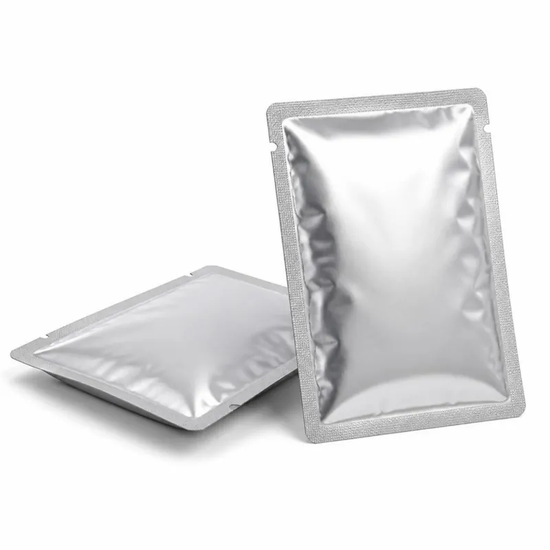 Two flat silver retort pouches with sealed edges